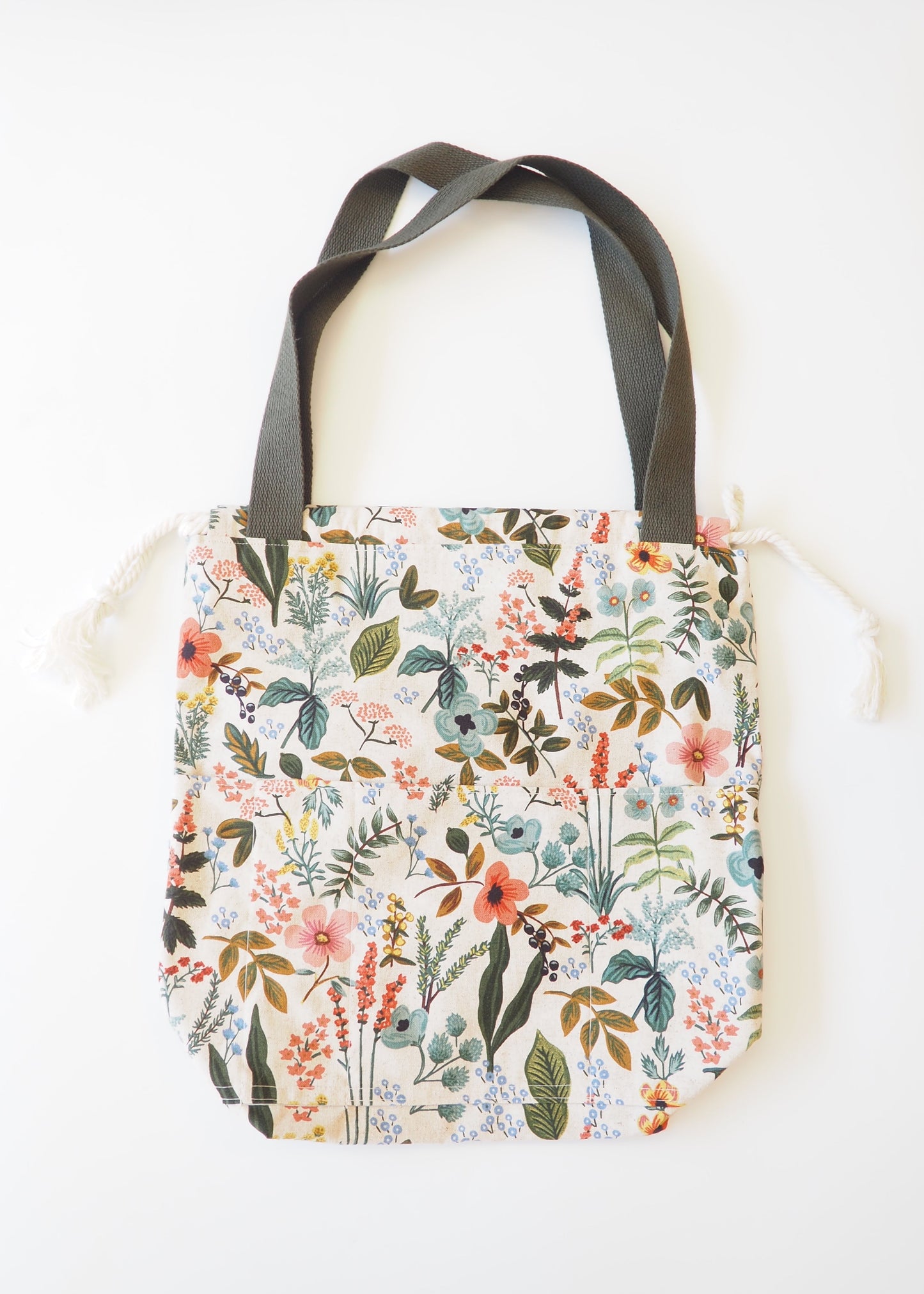 Tote bag with floral pattern on a white surface