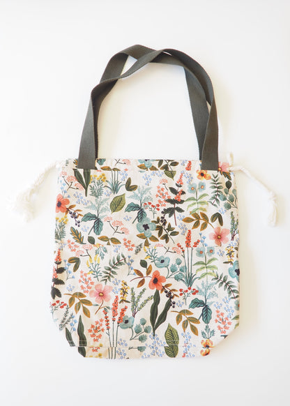 Tote bag with floral pattern on a white surface