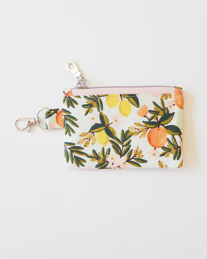 Fabric pouch with fruit pattern on a white background