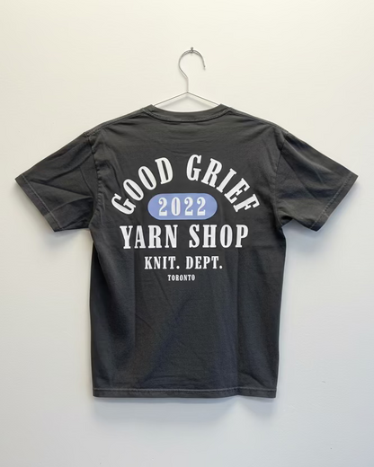Black t-shirt with 'Good Grief Yarn Shop' text on a white background