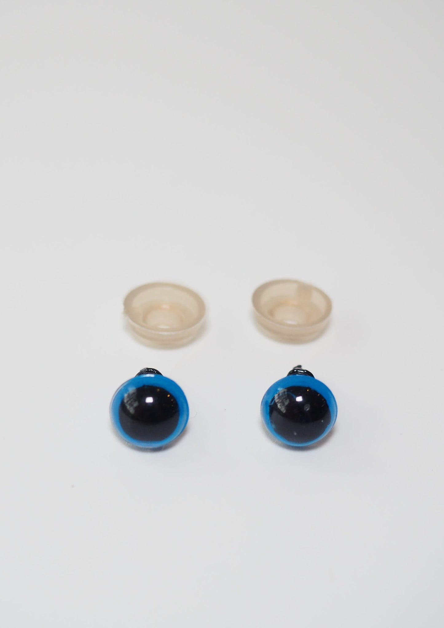Colorful plastic safety eyes for crafts, toys, and amigurumi. Pack of 2 pairs in varying sizes. Available at Good Grief Toronto