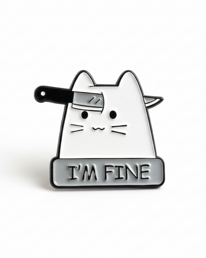 Enamel pin with a cat design holding a knife and 'I'm Fine' sign on a white background