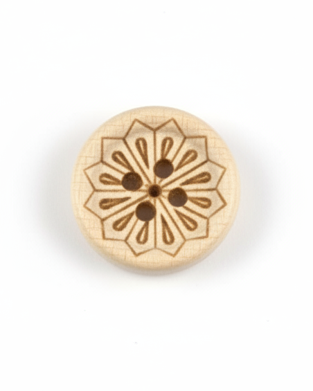 Decorative wooden button with intricate design on a plain background