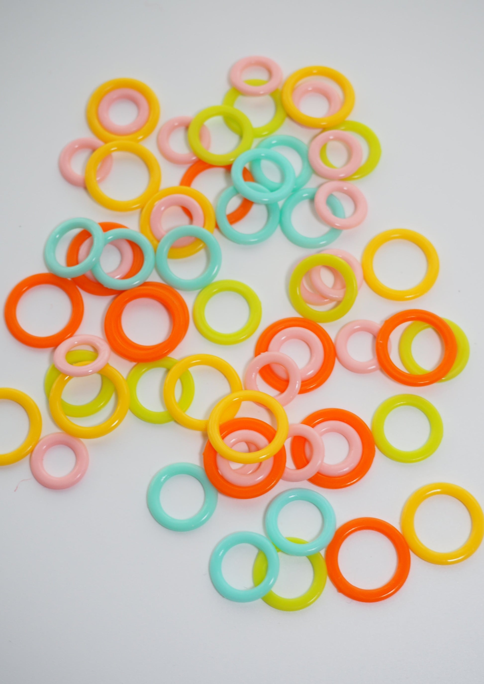 an image of many circle stitch markers in various sizes and colours