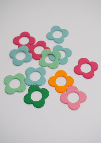 Colorful flower-shaped stitch markers for crafting