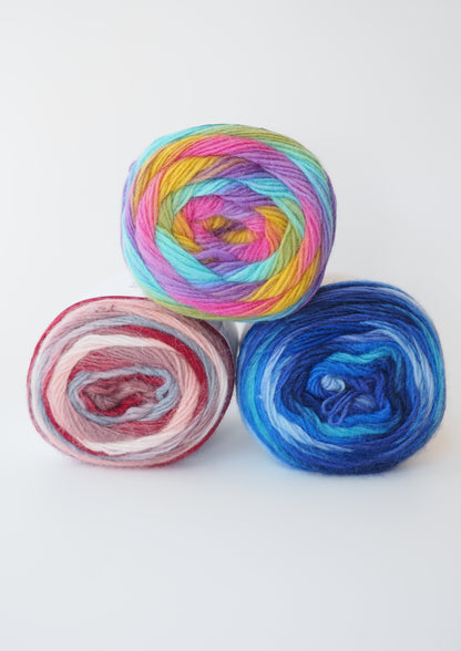 image of three balls of rico superba twirl 4ply sock yarn