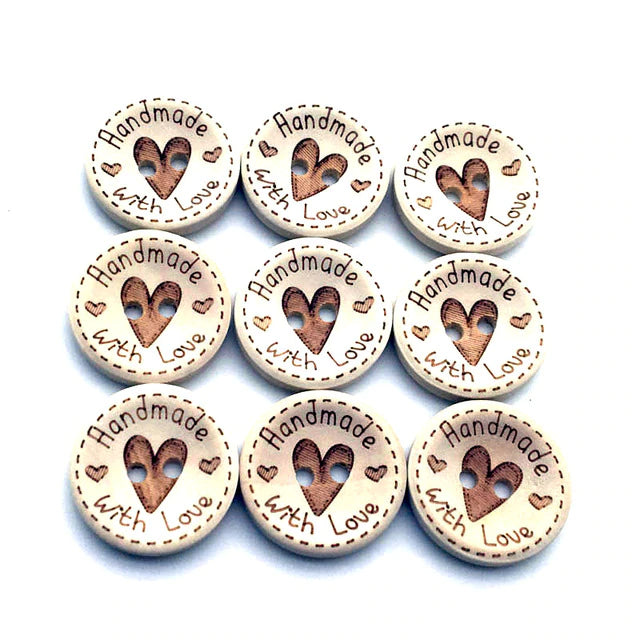 image of 9 wood buttons with a heart in the centre and the words "handmade with love"