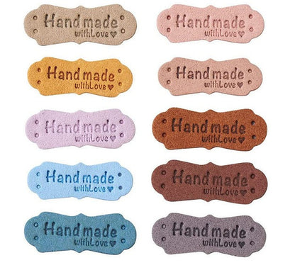an image with faux leather rectangular labels that say "handmade with love" 
