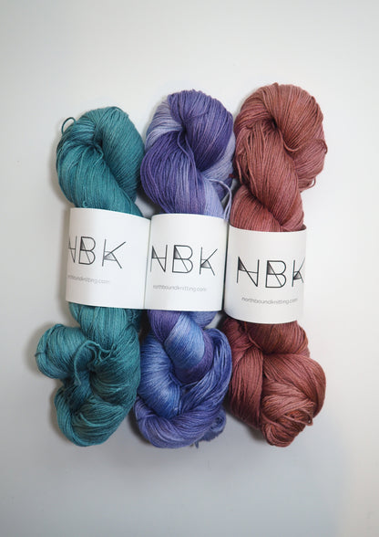 Image showcasing Northbound Knitting Cotton Fingering yarn, a soft and breathable 100% cotton yarn in a fingering weight. Ideal for summer knits and suitable for individuals with wool allergies. Available in a range of beautiful colors.