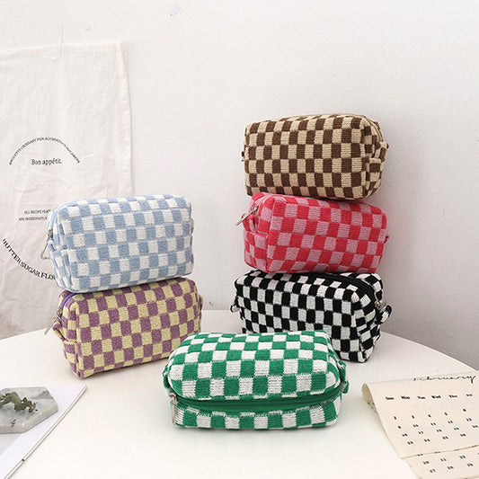 Image showcasing the Checkered Notion, Needle, and Hook Cases. These compact and stylish cases are designed for organizing and carrying knitting needles, crochet hooks, and notions. Perfect for on-the-go crafting.