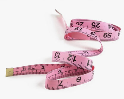 image of a pink soft measuring tape for body measurements and crafting